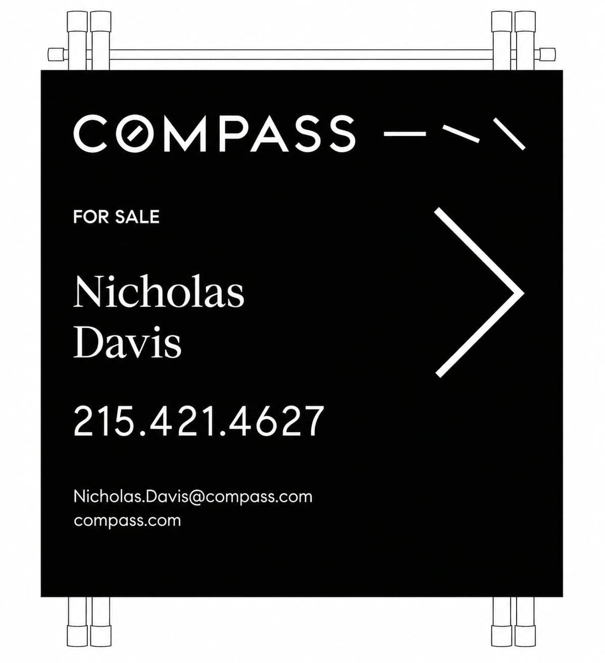 Nicholas Davis with a for-sale sign